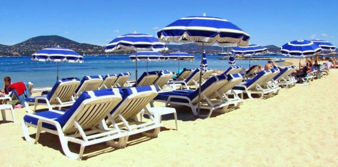 Beach chairs and umbrellas at saint tropez beach, Côte d'Azure